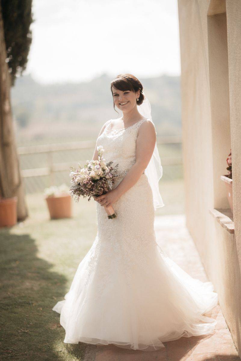 The blushing bride in her gorgeous gown