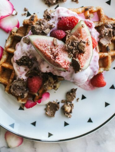 Waffles with fruit, chocolate, and yogurt topping