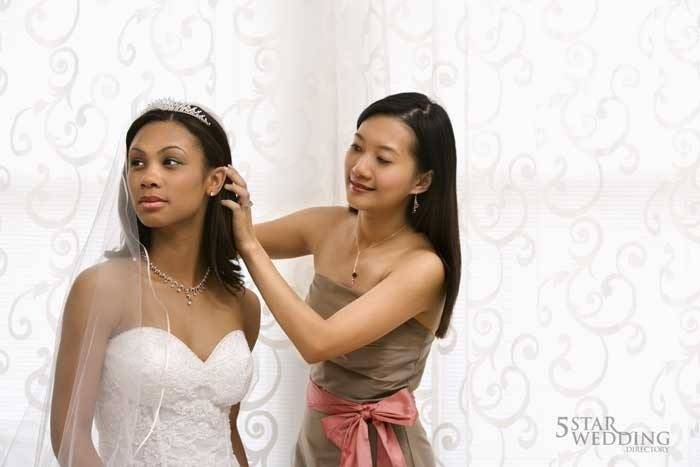 bridemaid helping bride