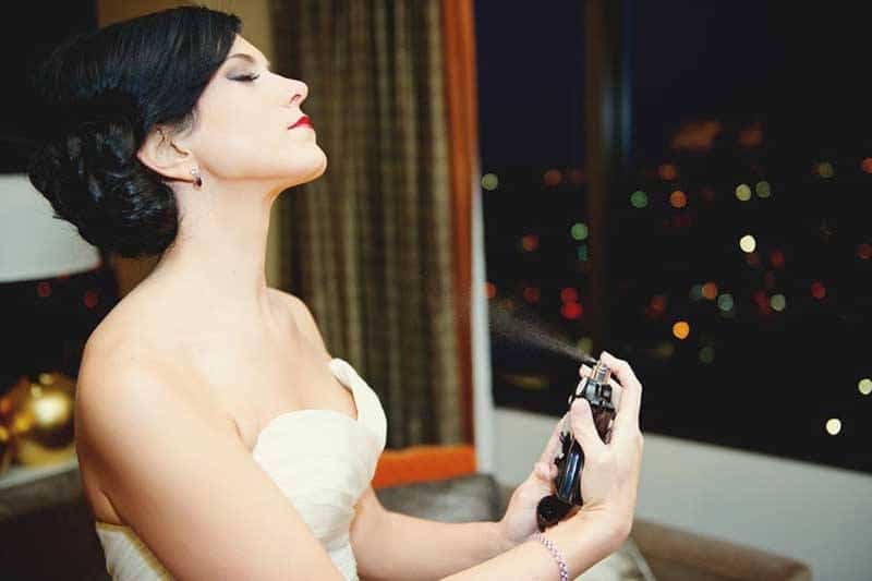 Bride Putting Perfume On