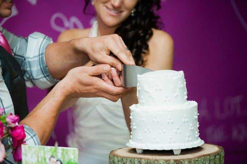 Bride and Groom Cutting Cake