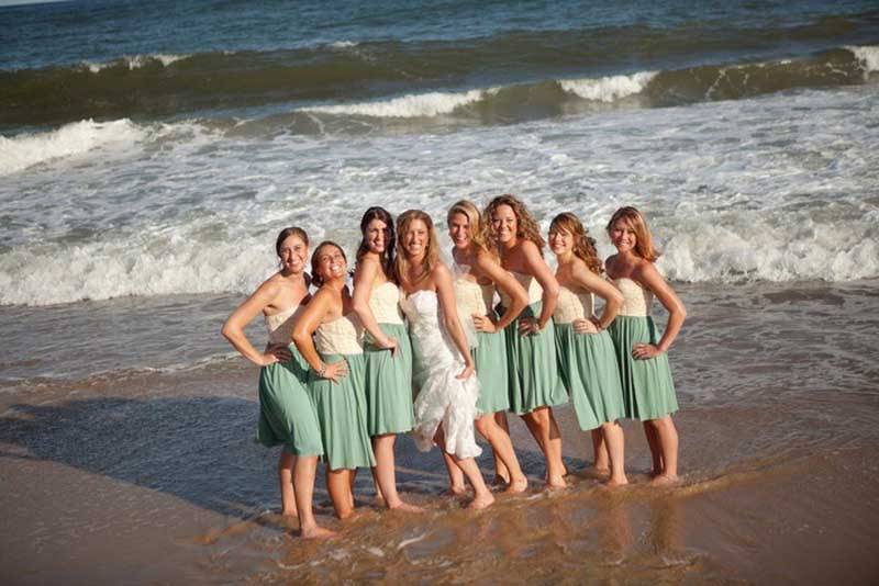 Bride With Bridesmaids On Beach