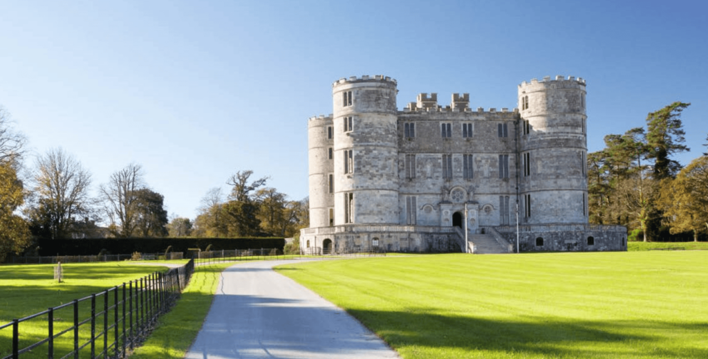 Be A Princess On Your Wedding Day At Lulworth Castle Historic gray stone castle under clear blue sky.