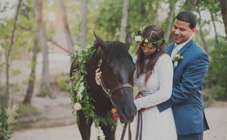 Bride and groom with horse