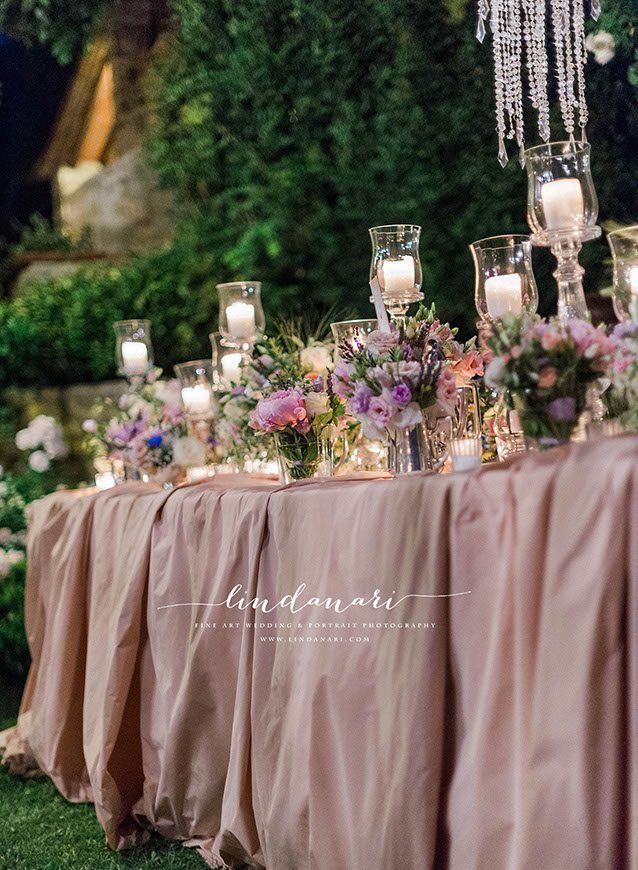 Sumptuous lace table cloths with flowers and sparkling candles as far as the eye can see. Sumptuous lace table cloths with flowers and sparkling candles as far as the eye can see.