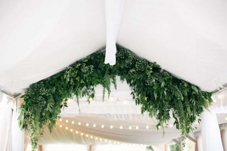 A lush green foliage arch makes a striking entrance. Pair with spotlights or twinkling fairy lights for a magical wedding wonderland. Photo: Lisa Foster Floral Design A lush green foliage arch makes a striking entrance. Pair with spotlights or twinkling fairy lights for a magical wedding wonderland. Photo: Lisa Foster Floral Design