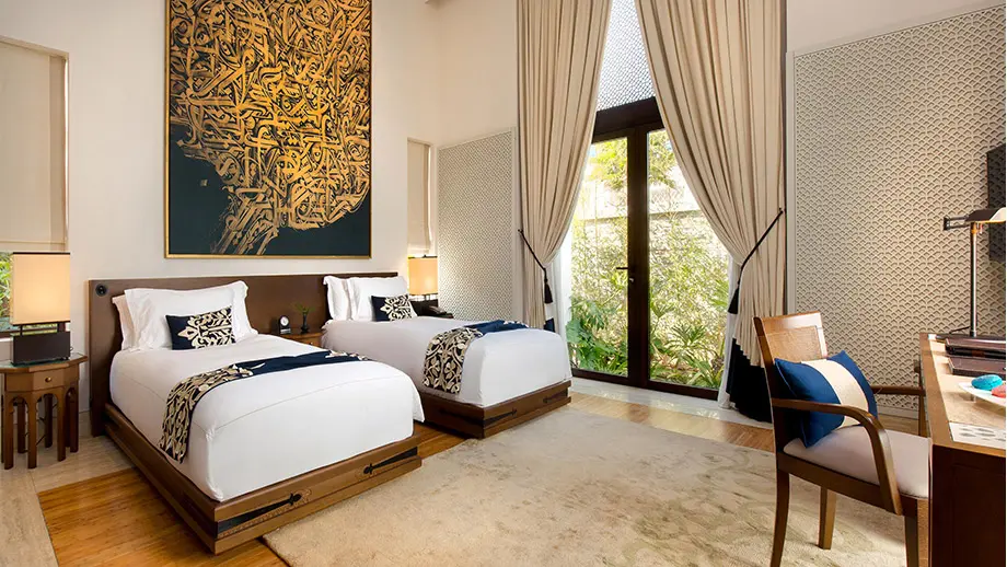 Banyan Tree Tamouda Bay Elegant twin bedroom with large window