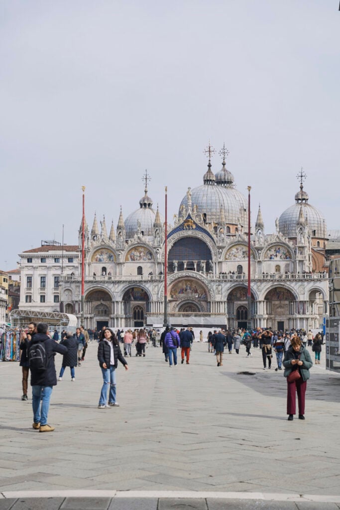 A Vision Of Venice Weddings People walking in front of historic cathedral