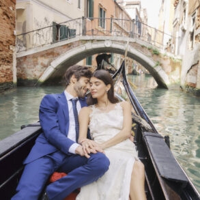 Couple in gondola on Venice canal