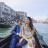 Couple enjoying gondola ride in Venice canal