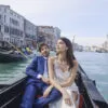 Couple enjoying gondola ride in Venice canal