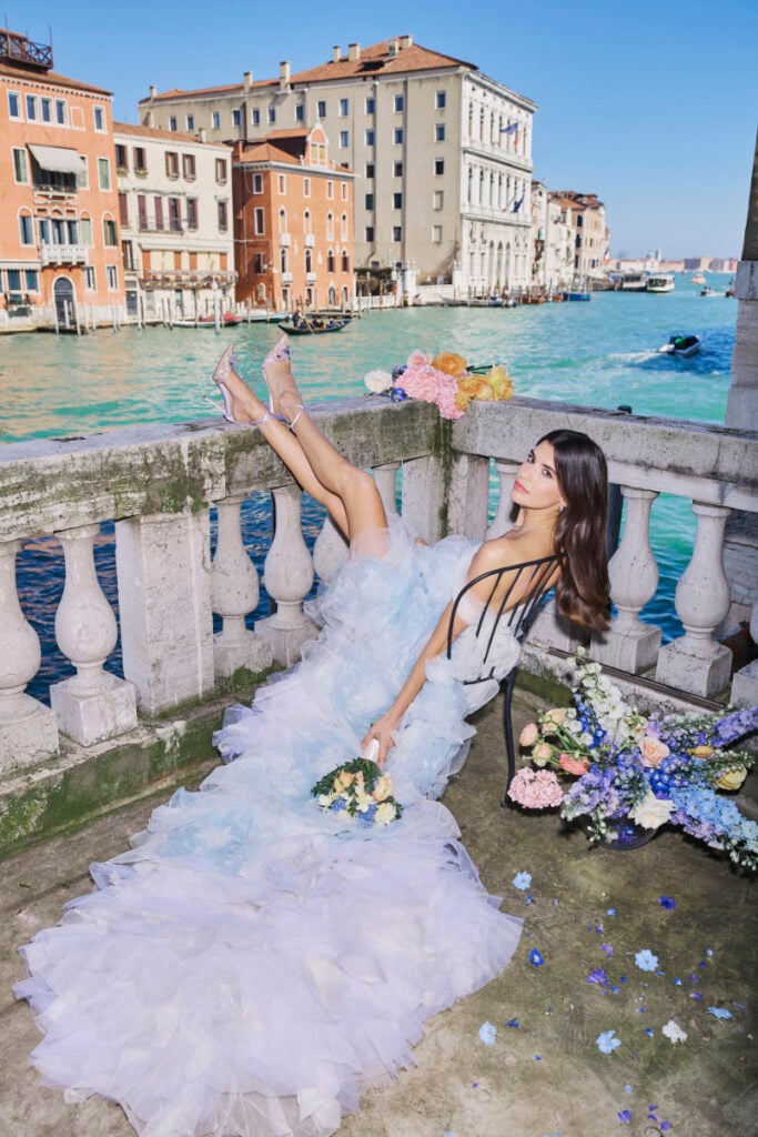 A Vision Of Venice Weddings Woman in elegant gown by Venetian canal