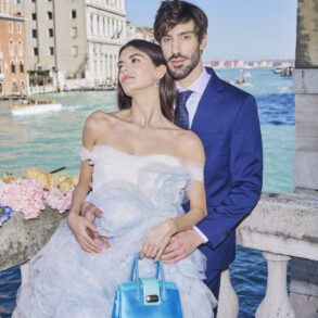 Couple posing by canal in Venice
