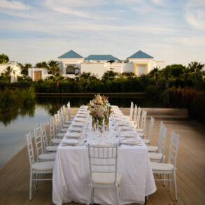 Elegant outdoor dining table setup at sunset.