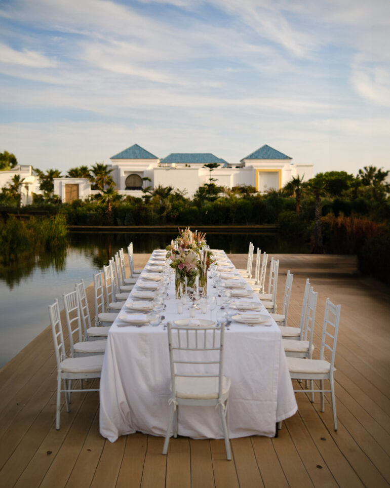 Elegant outdoor dining table setup at sunset.