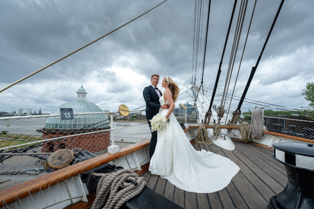 A Nautical Dream: A Timeless Wedding Shoot at Cutty Sark, Greenwich Wedding couple on a ship's deck.