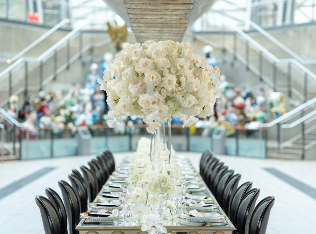 A Nautical Dream: A Timeless Wedding Shoot at Cutty Sark, Greenwich Elegant banquet setup with white floral centrepiece.