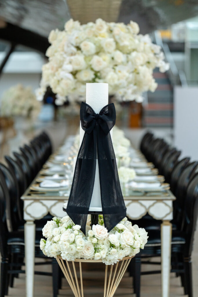 A Nautical Dream: A Timeless Wedding Shoot at Cutty Sark, Greenwich Elegant table setting with flowers and black ribbon