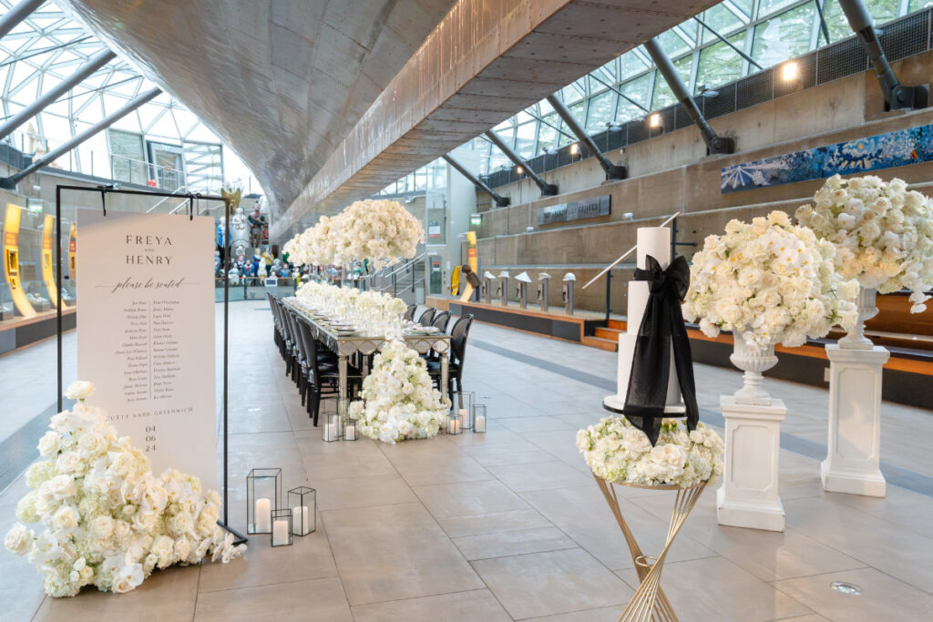 A Nautical Dream: A Timeless Wedding Shoot at Cutty Sark, Greenwich Elegant wedding reception with flower arrangements and seating.
