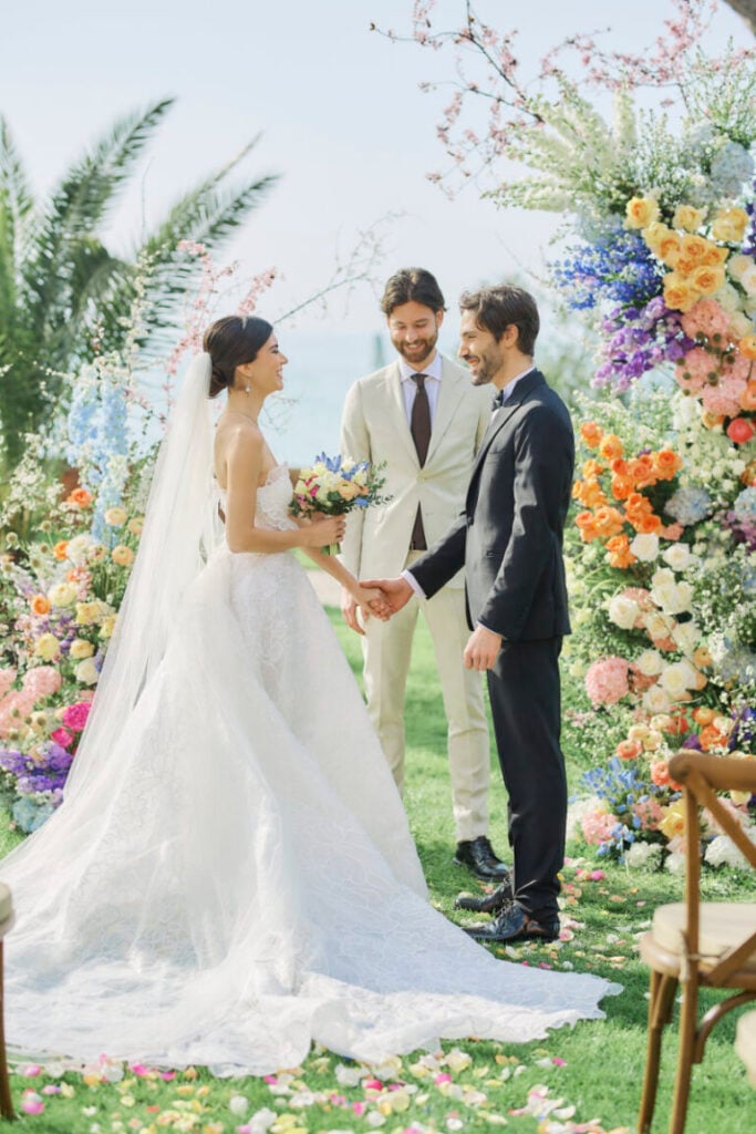 A Vision Of Venice Weddings Couple exchanging vows in garden wedding ceremony