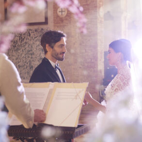 Bride and groom exchanging vows in church