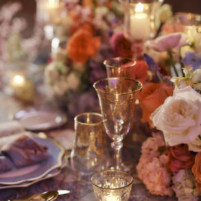 Elegant table setting with flowers and candles.