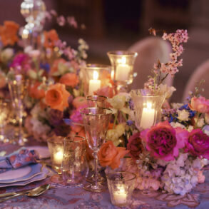 Elegant dinner table with flowers and candles.