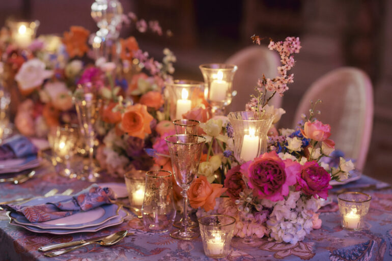 Elegant dinner table with flowers and candles.