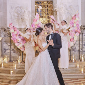 Couple dancing at luxurious wedding reception.