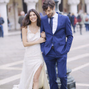 Bride and groom walking, outdoor background