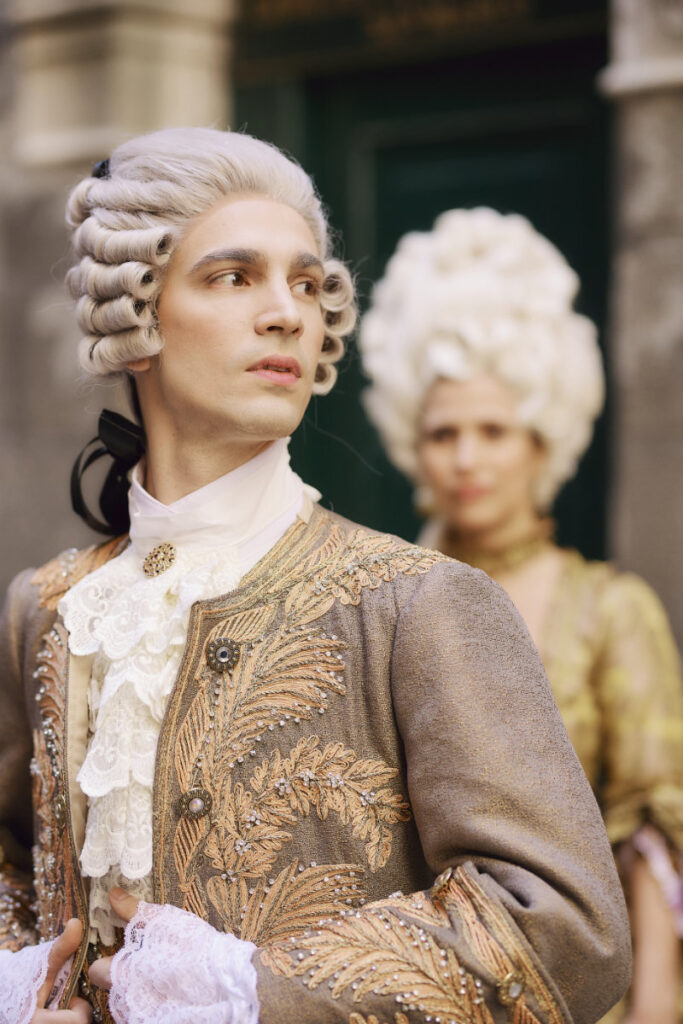 A Vision Of Venice Weddings Couple in ornate 18th-century wigs and attire.
