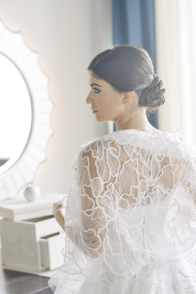 Bride in intricate white lace dress