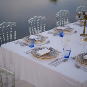 Elegant outdoor dining setup near water