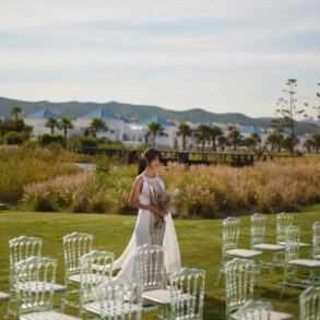 Bride with bouquet in outdoor wedding setting