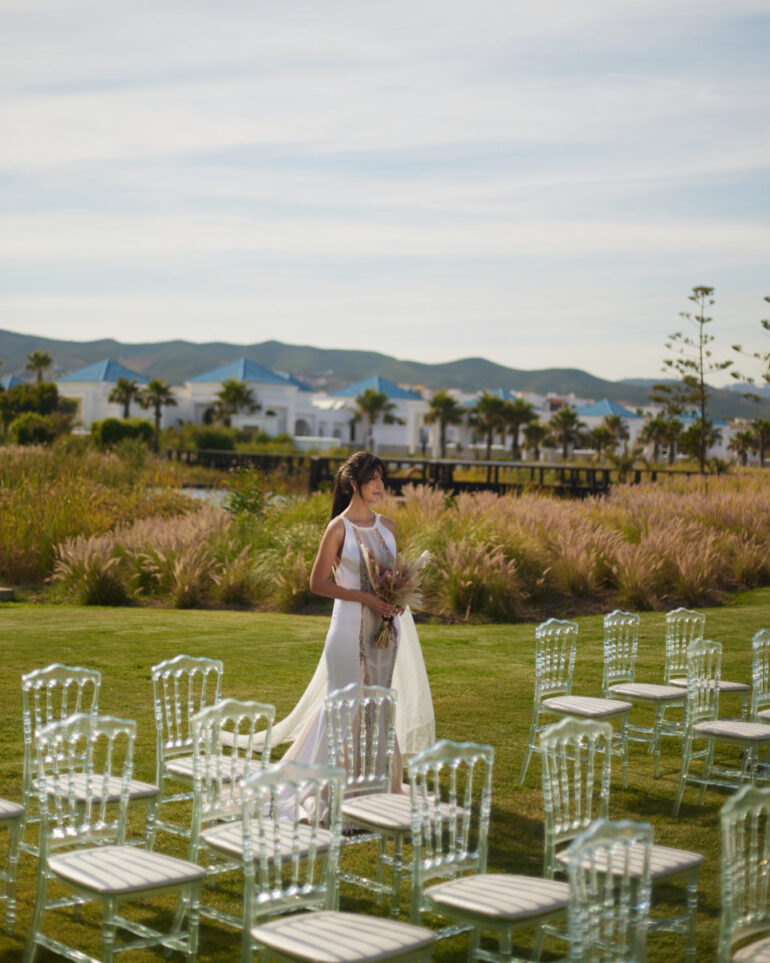Bride with bouquet in outdoor wedding setting
