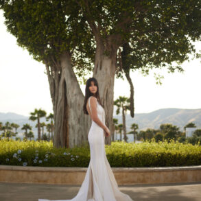 Woman in elegant white dress outdoors