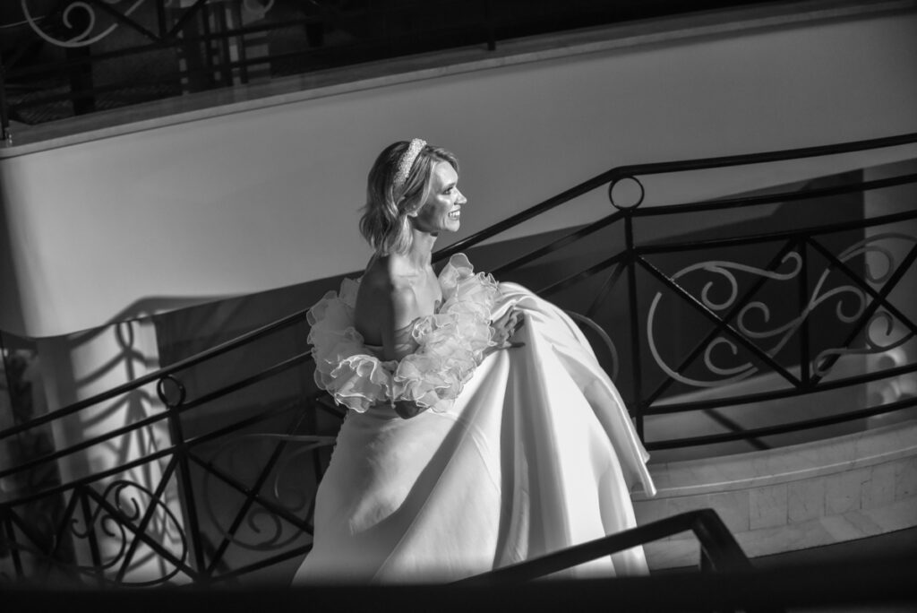 Unveiling the Best Wedding Photographer in Stevenage Woman in elegant gown on staircase