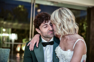 Bride and groom embrace on wedding day.