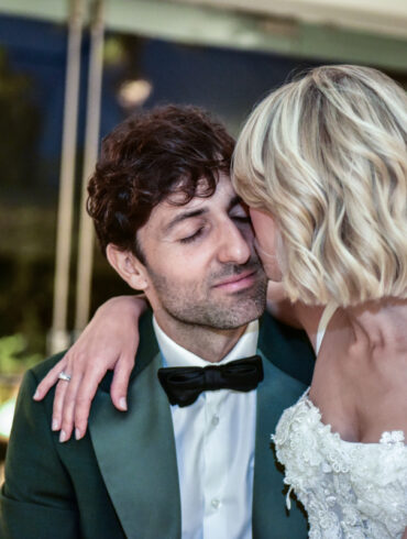 Bride and groom embrace on wedding day.