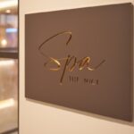 The NICI Spa sign on interior wall.