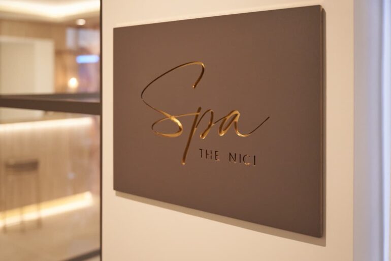 The NICI Spa sign on interior wall.