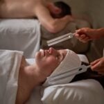 Couple enjoying relaxing spa treatment.