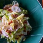 Fresh salad with radishes and crispy bacon.