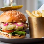 Gourmet burger with fries on a plate