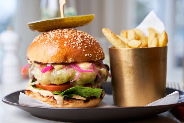 Gourmet burger with fries on a plate