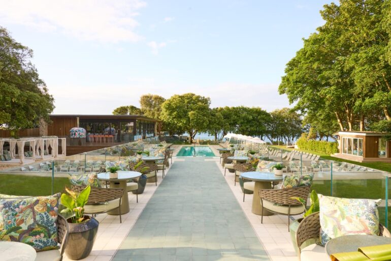 Outdoor seating area with pool and trees