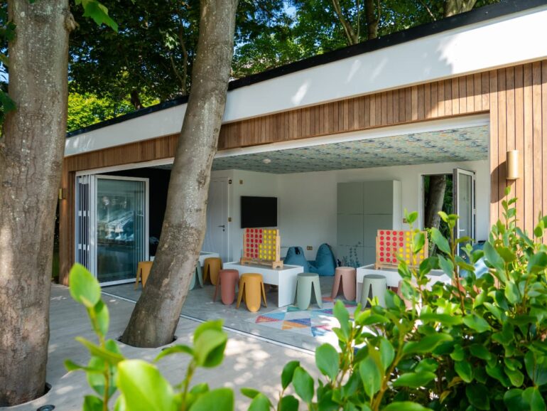 Garden play area with colourful furniture.