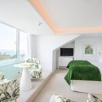 Bright coastal hotel room with sea view