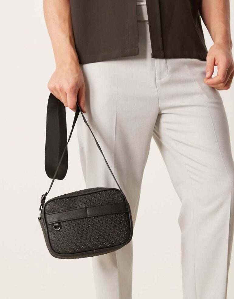 ASOS DESIGN faux leather crossbody bag with monogram detail in black