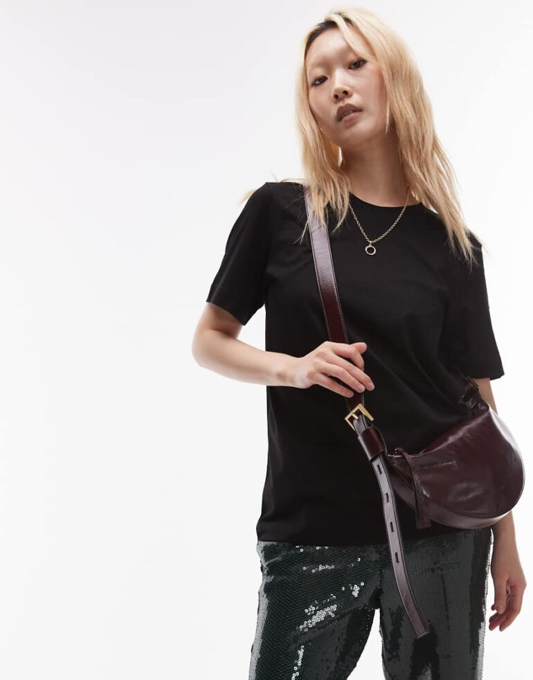 AllSaints half moon leather crossbody bag in burgundy-Red